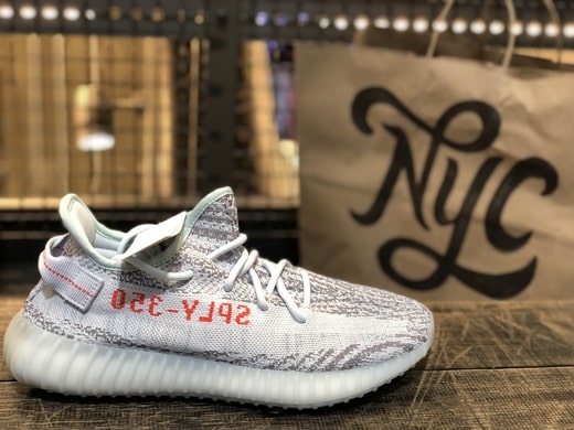 Yeezy 350 V2 Blue-Tints with an Adidas bag in the background, marked "NYC"