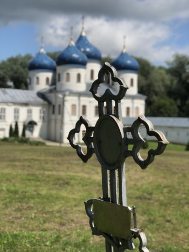 A cross outside of a monastery in a rural part of Russia